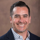 Jose Villarreal headshot with a brown background
