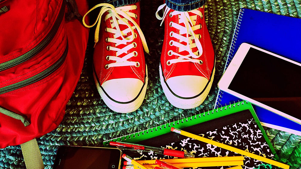 child's sneakers and school supplies