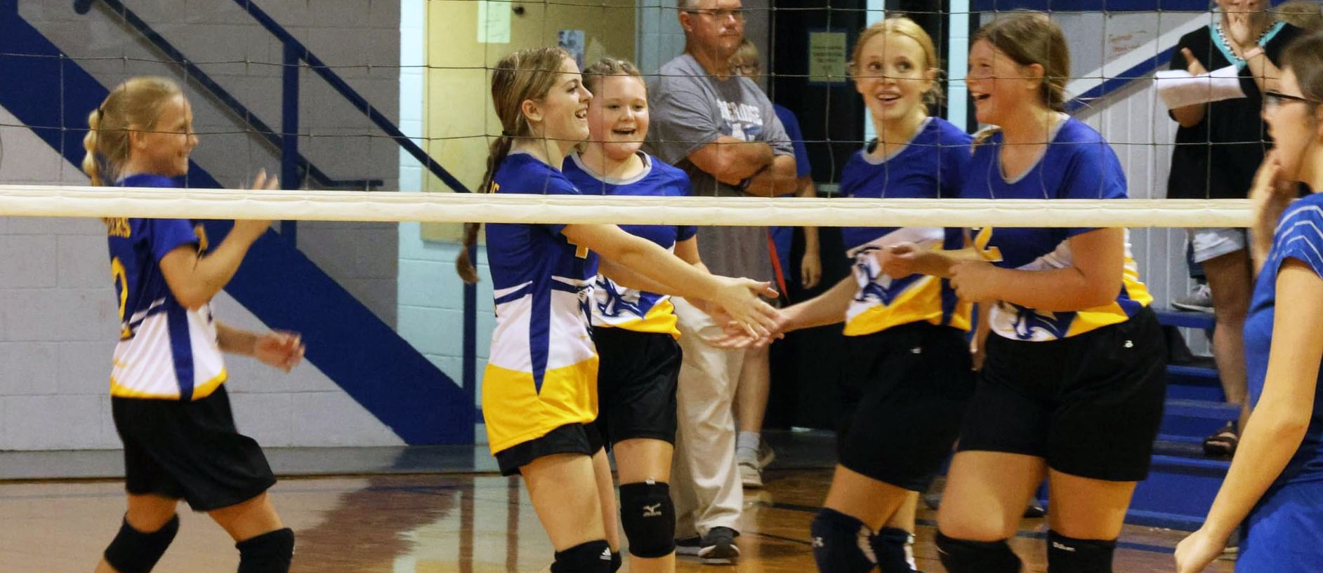 Volleyball Players Laughing After Good Play