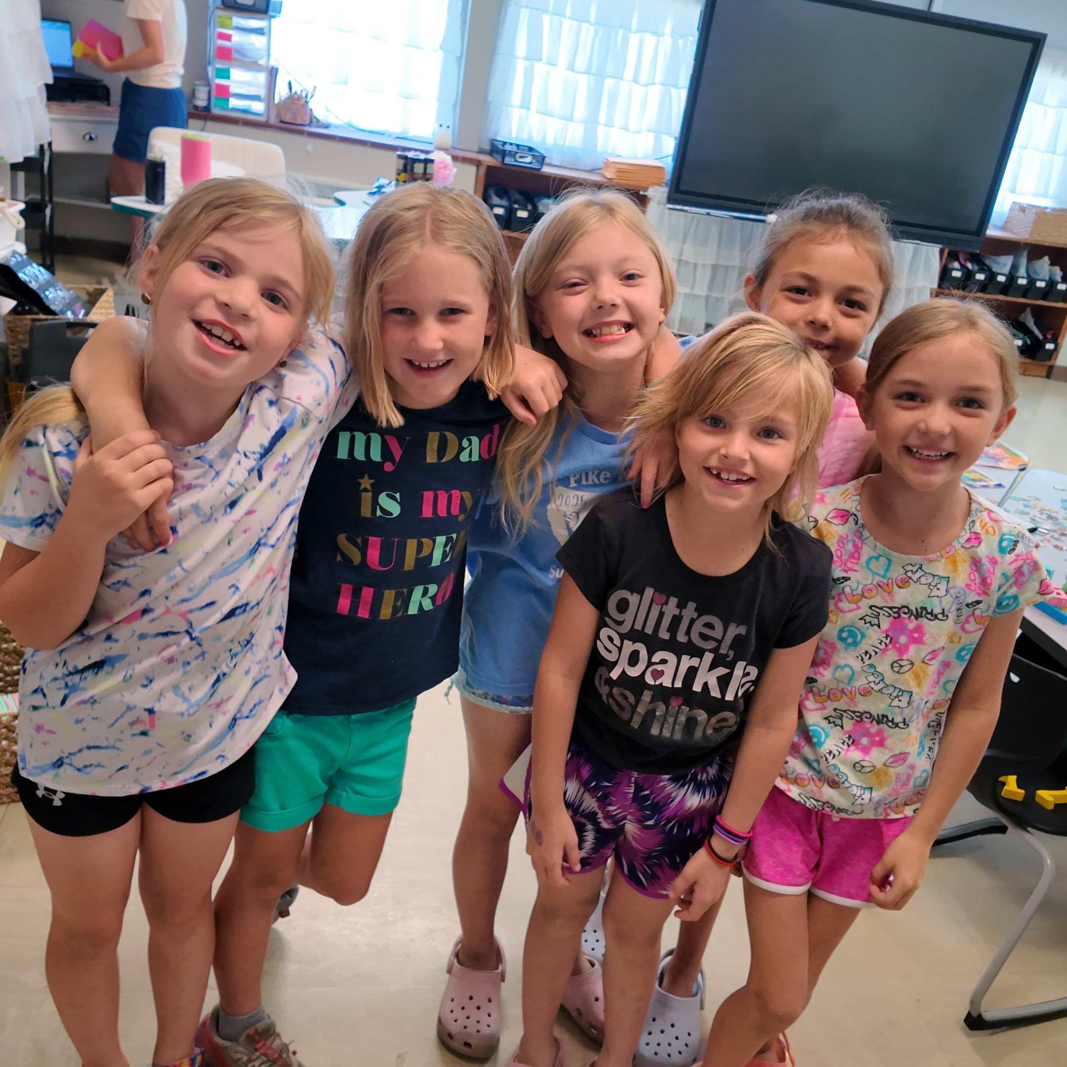 group of six first graders smiling