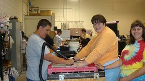 BGLC students creating recycled paper in the papermaking room.