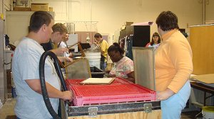 BGLC students waiting to make paper in the papermaking room.