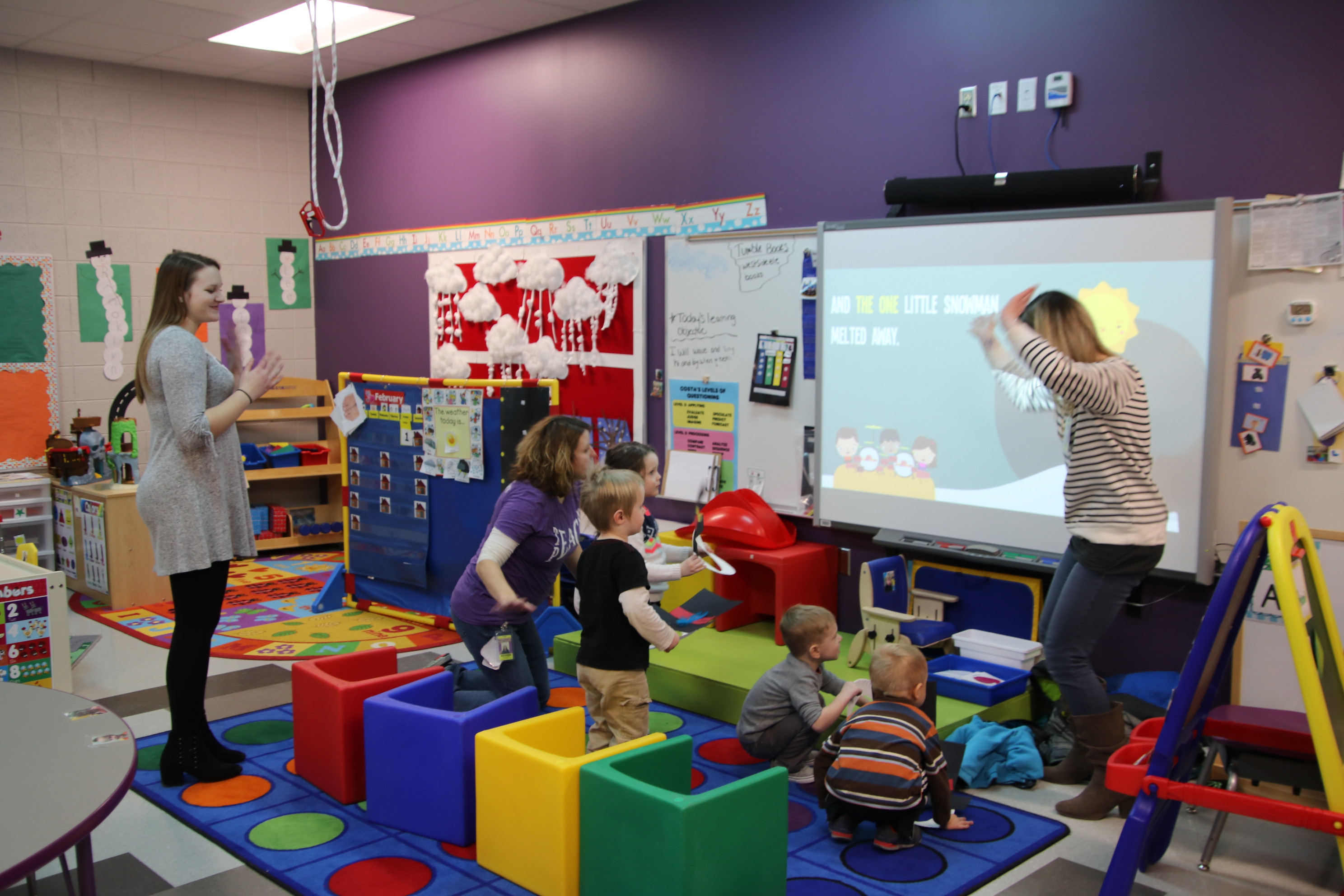 Teachers and students in special education classroom 