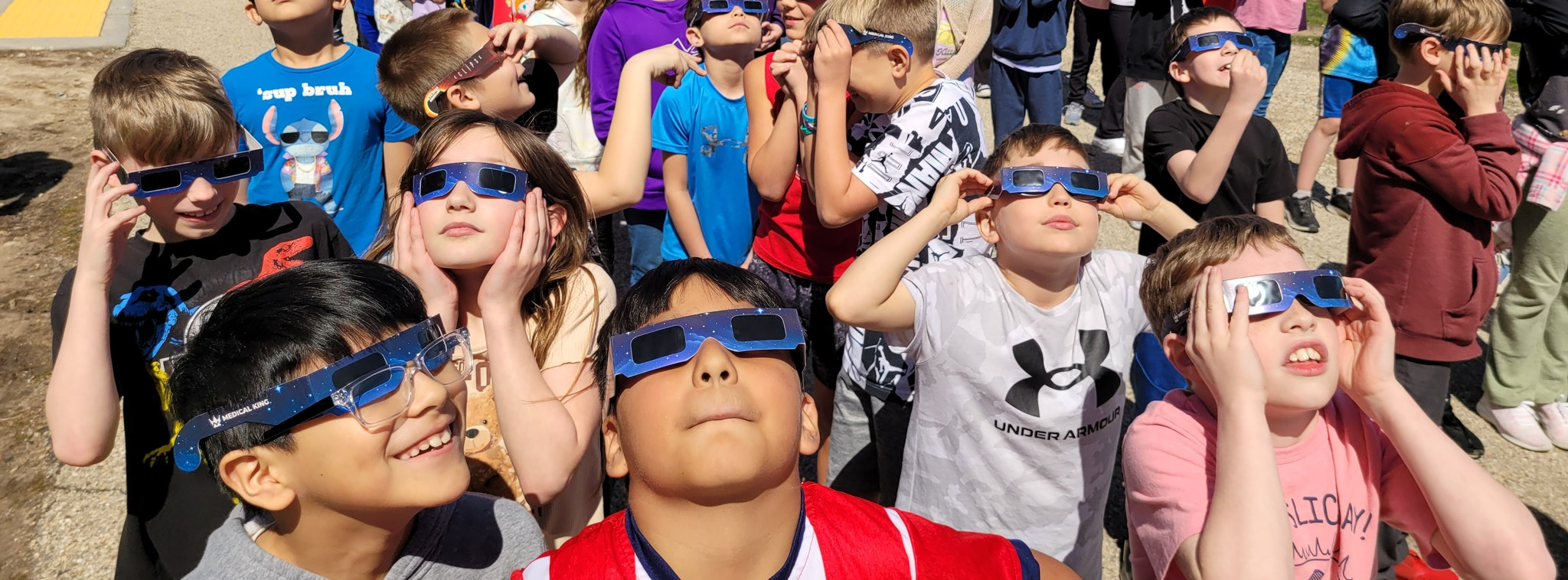 Students looking at eclipse