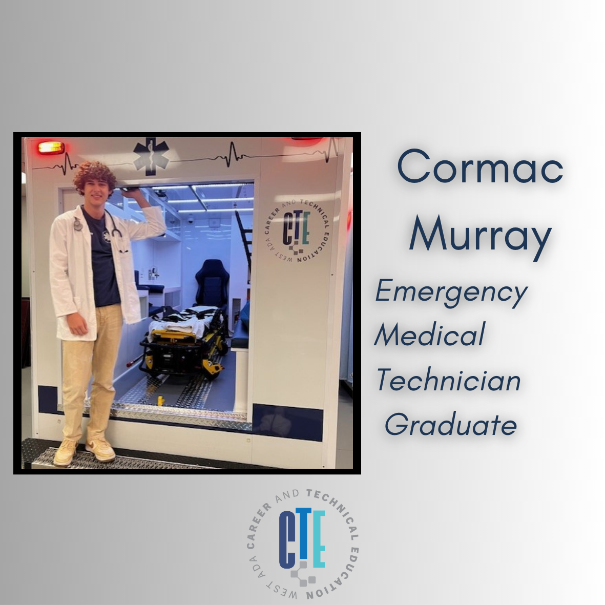 a smiling student in a simulation of an ambulance wearing medical industry standard clothing. 