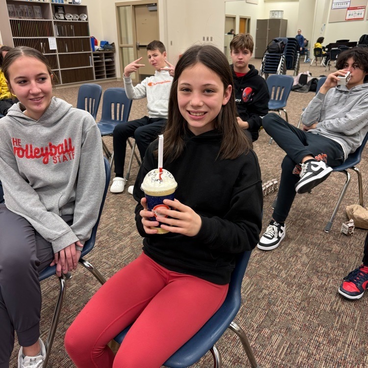 student with smoothie