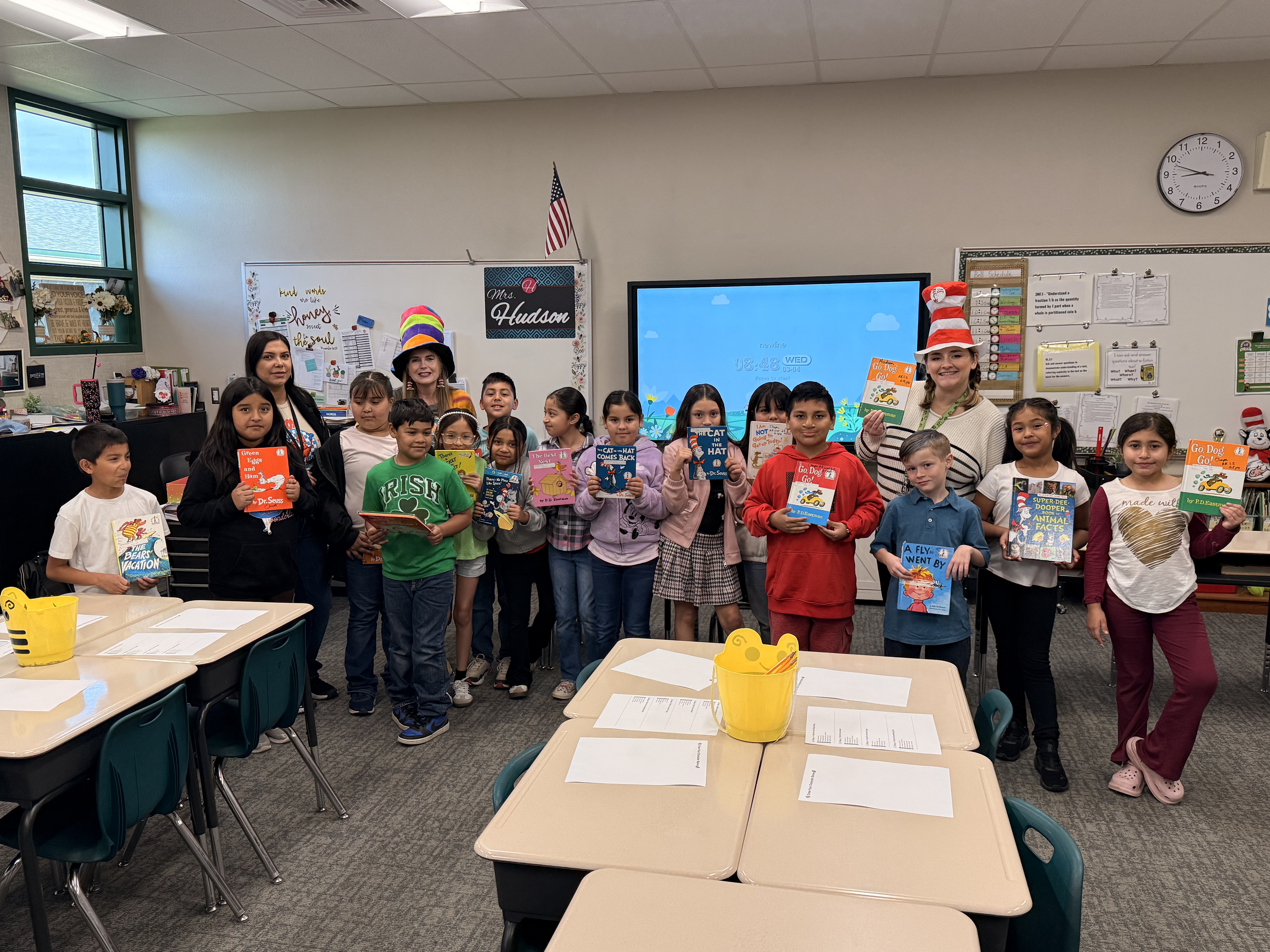 Dr Suess Read Across America staff reading to students