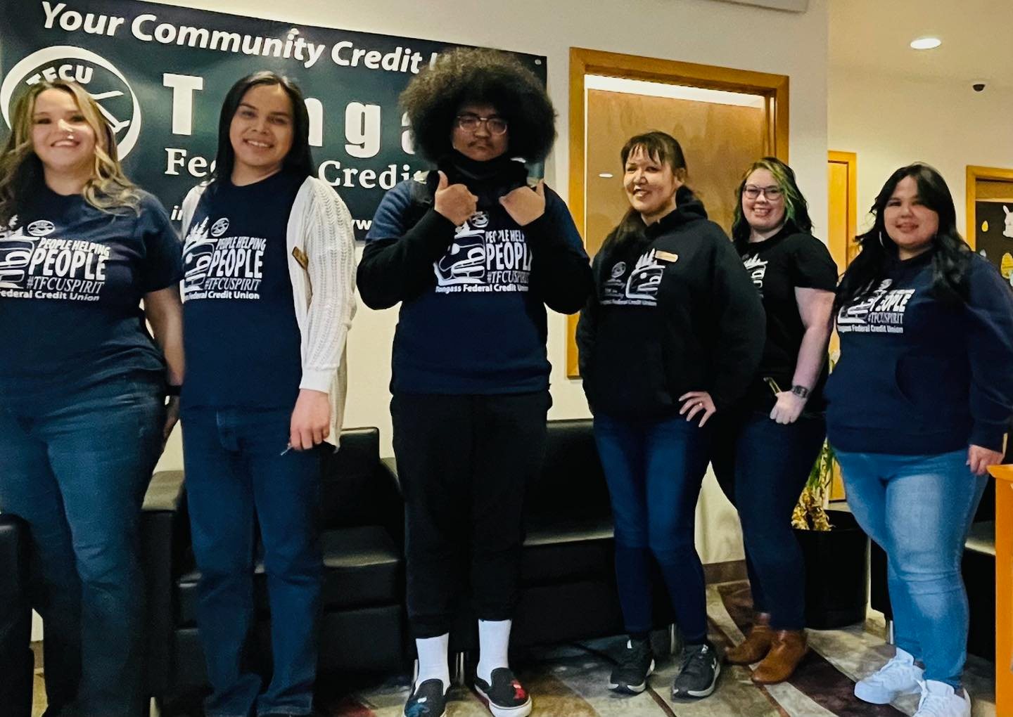 student at a bank with bank employees