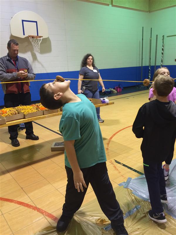 photo of students in a gym doing activities