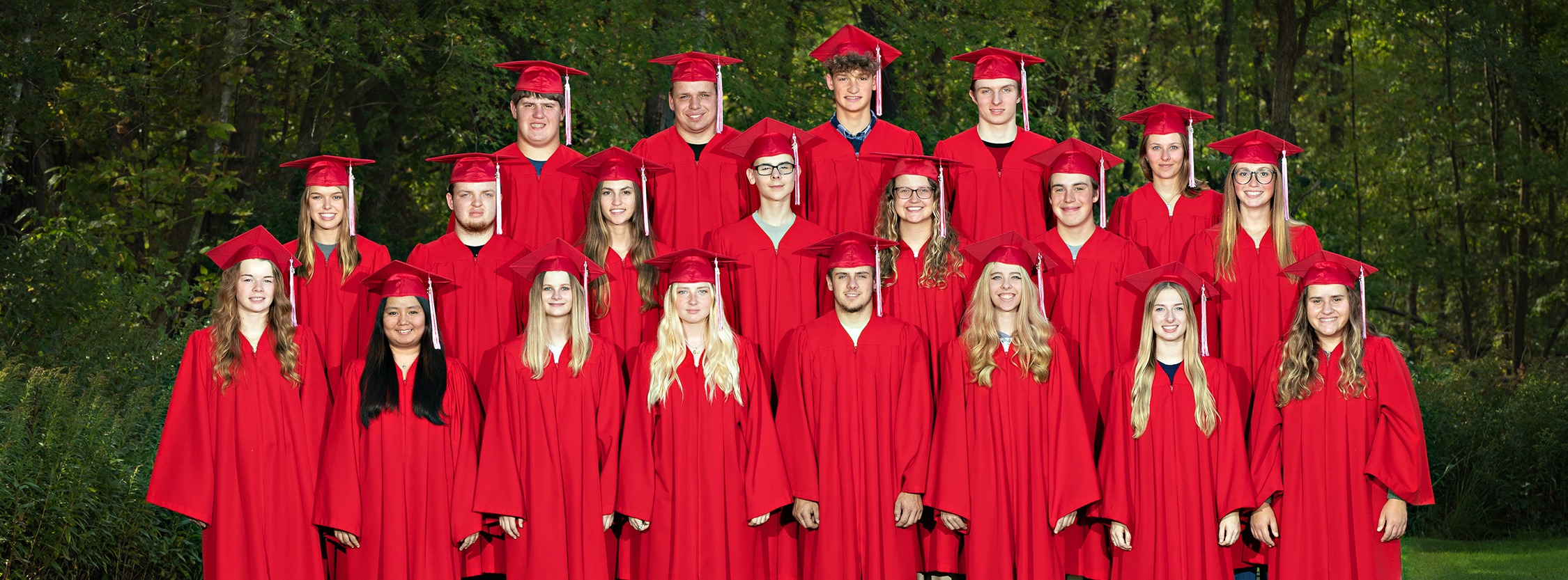 students standing in cap and gowns