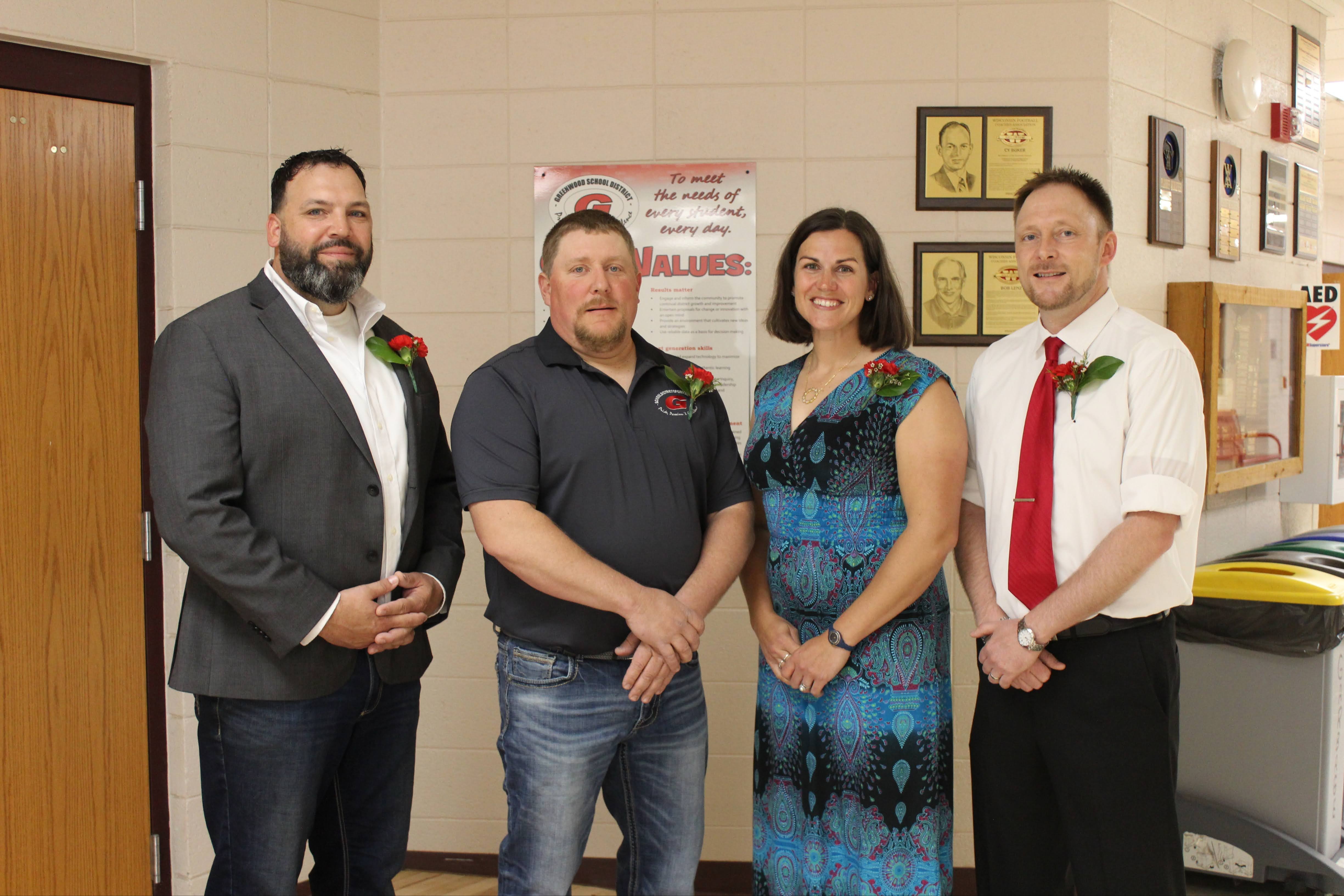 School Board Members standing together in school hallway