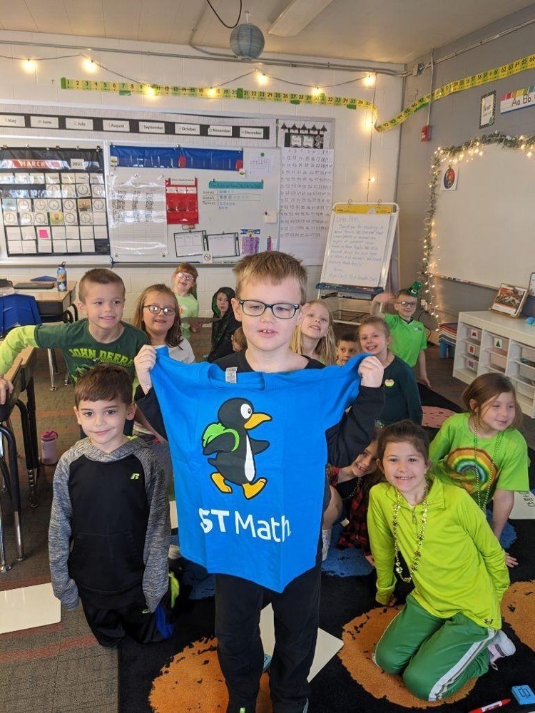Student posing with shirt that reads ST math