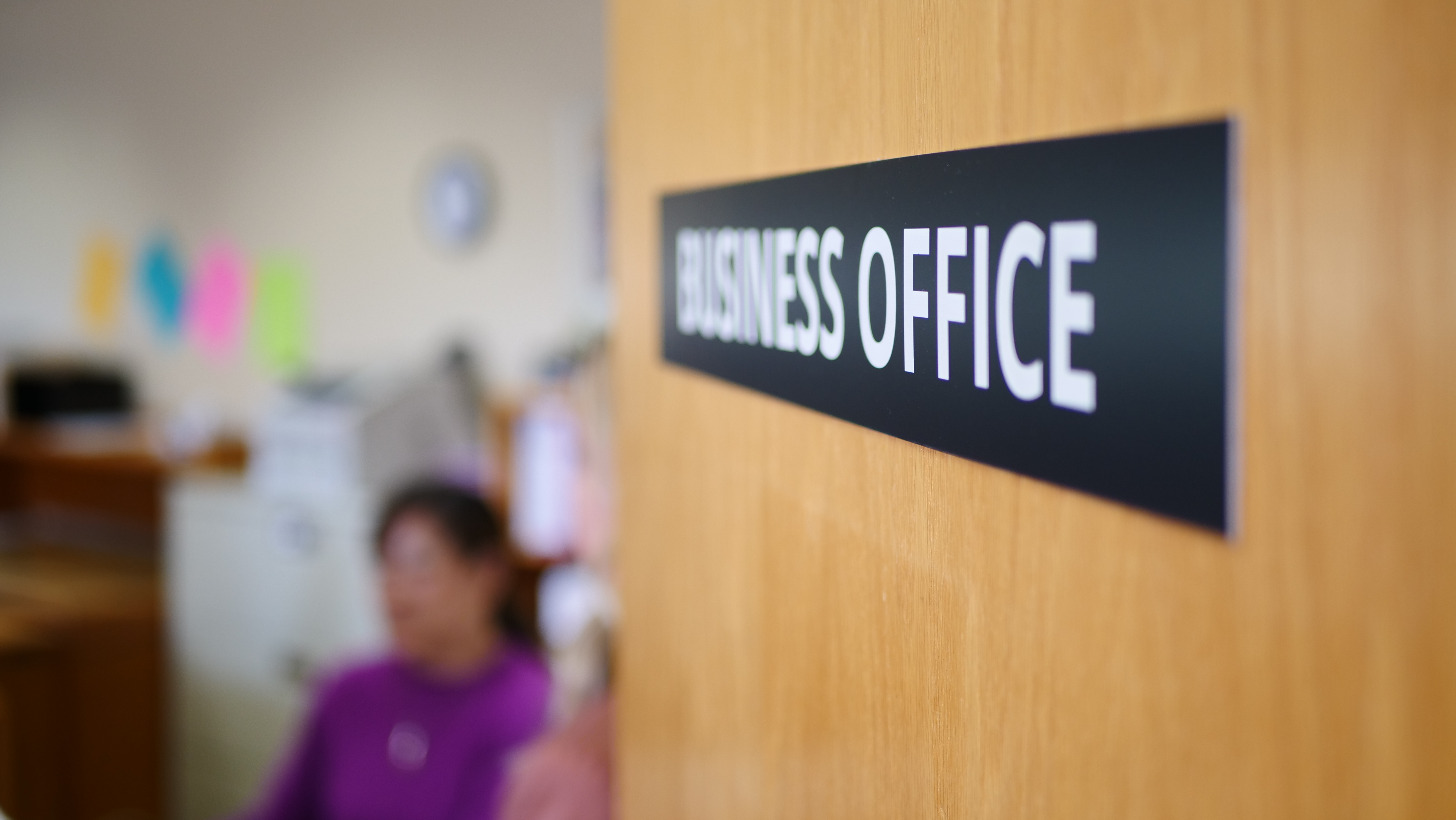 Business Office door and staff