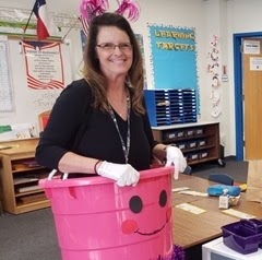 Photo of teacher with a pink bucket