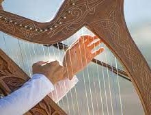 Photo of someone's hands playing the harp