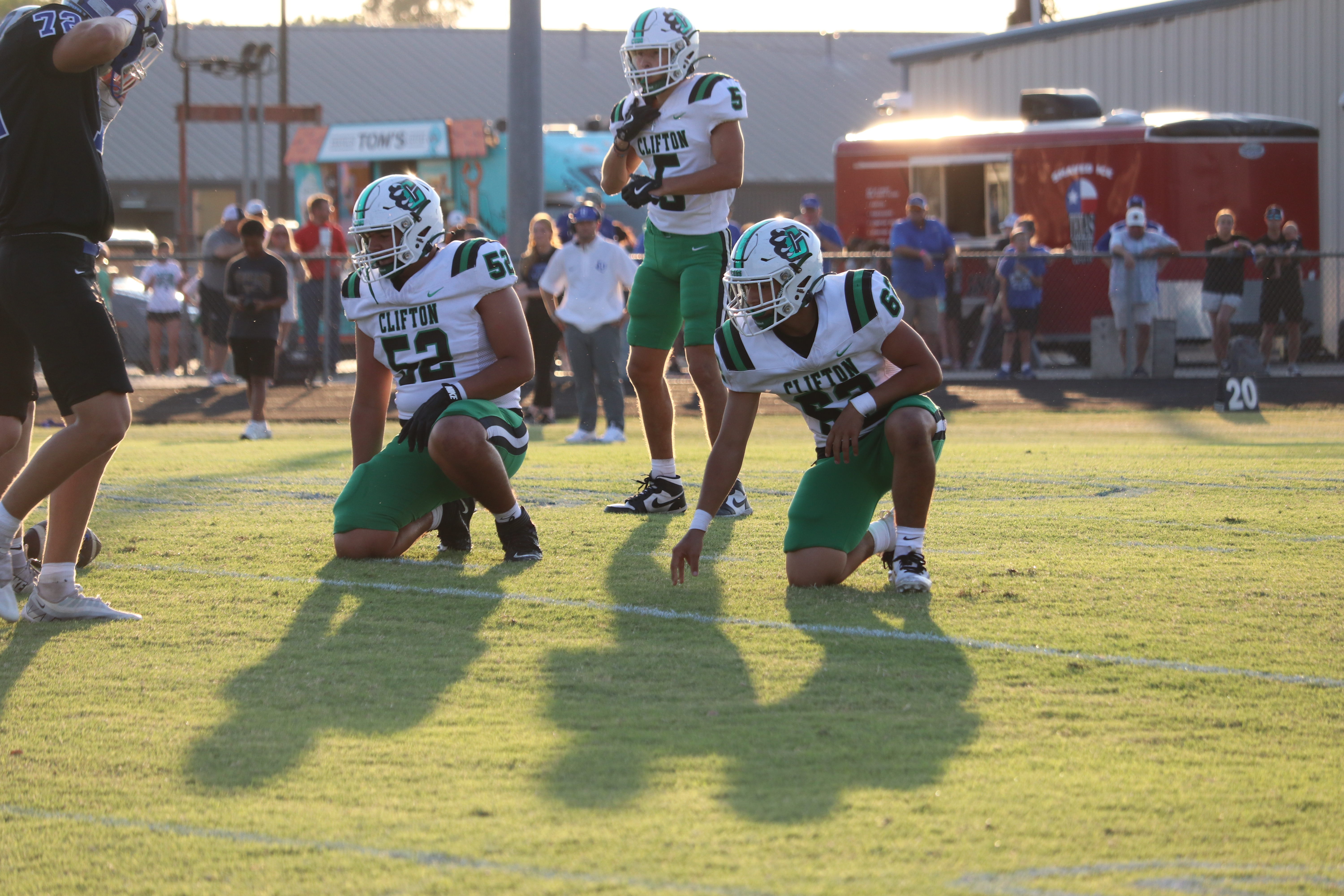 Football players on a knee