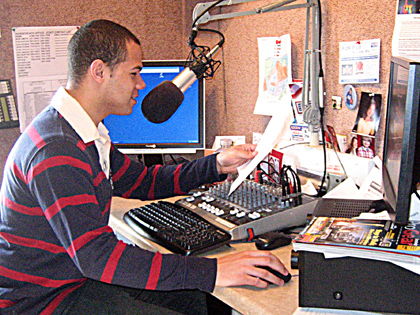 A CTE Audio Media Design student records a radio commercial at Cool 96 radio station. 