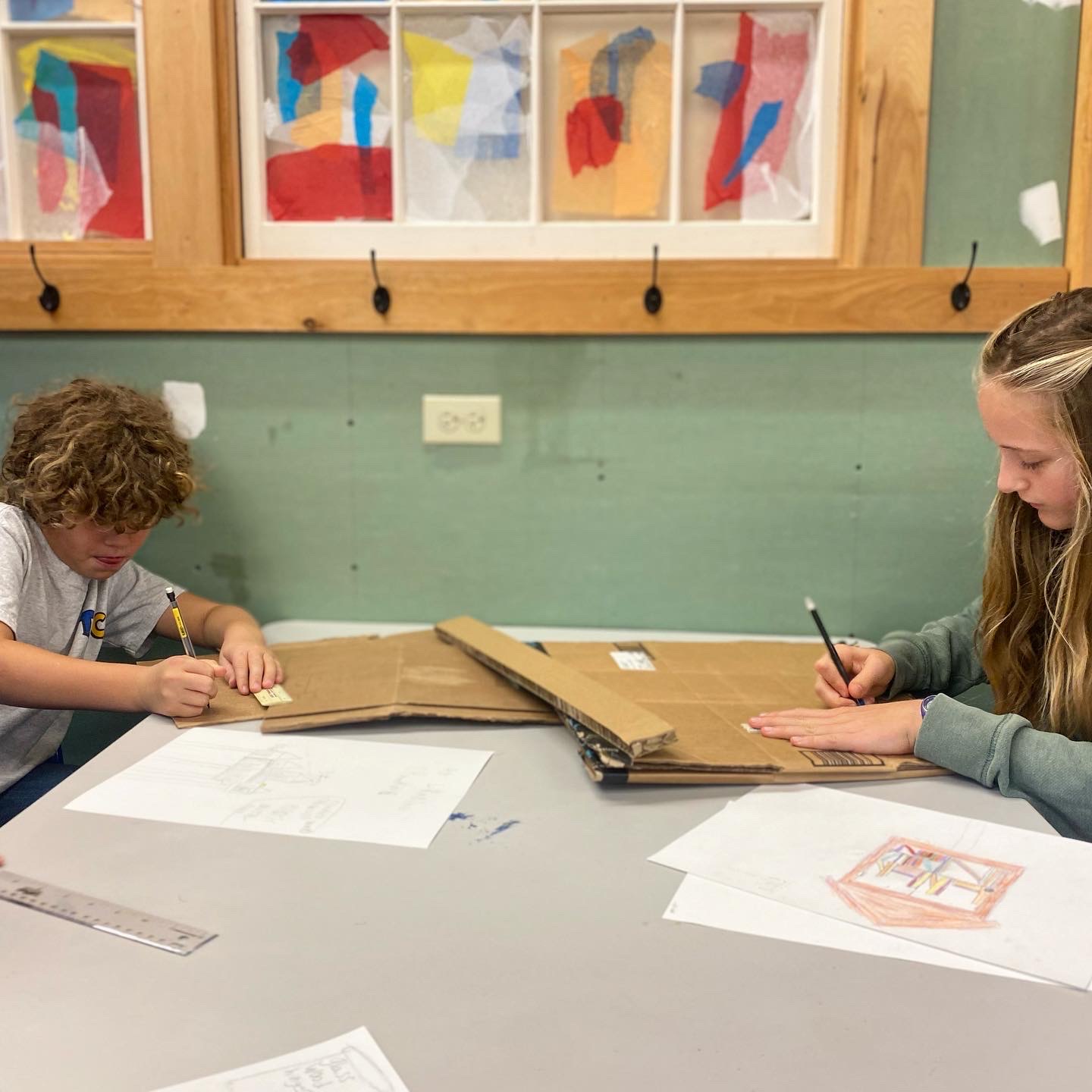 drawing the designs on cardboard