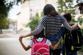 parent walking child to school