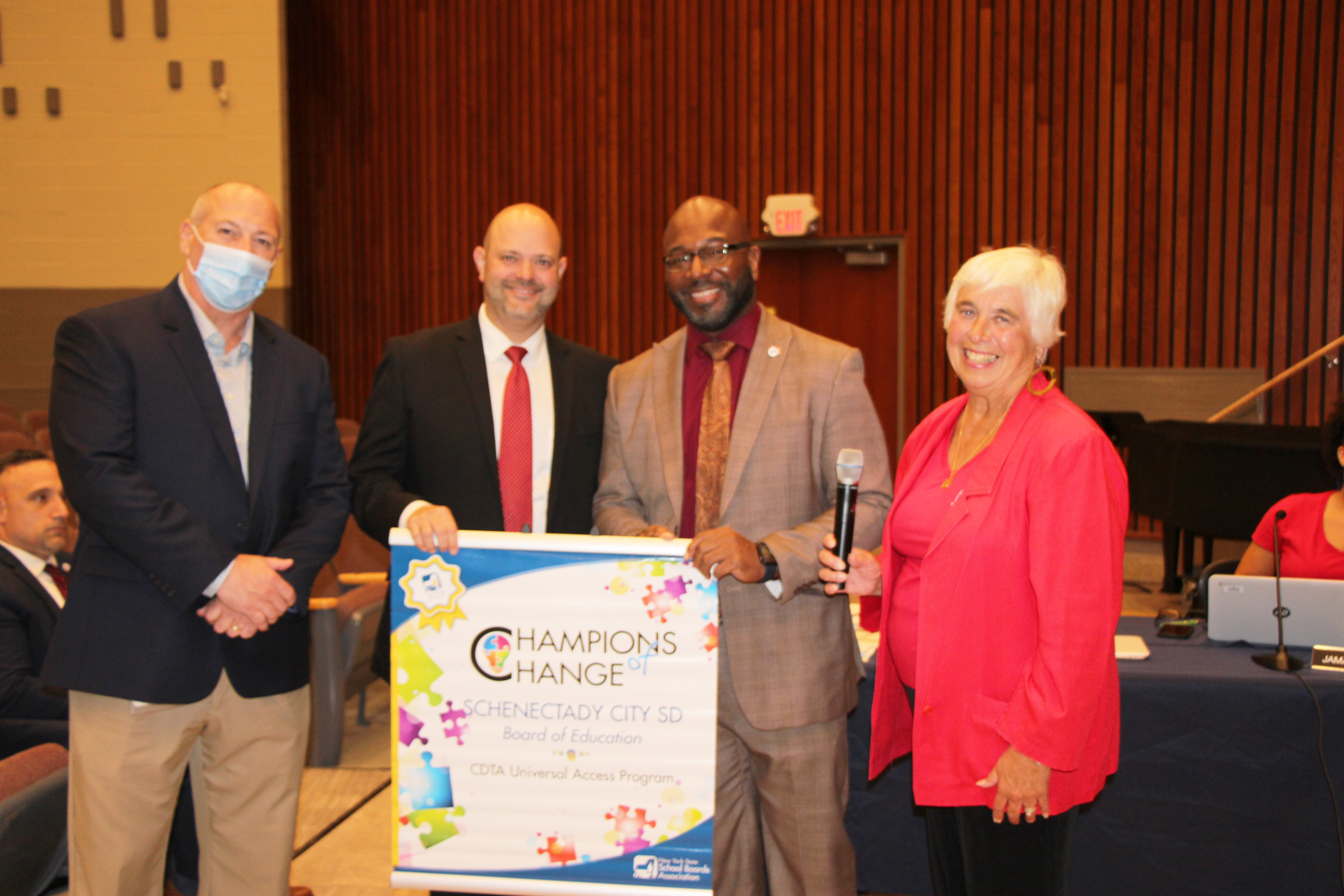 CDTA and SCSD Transportation Supervisor are presented with Champions of Change Banner