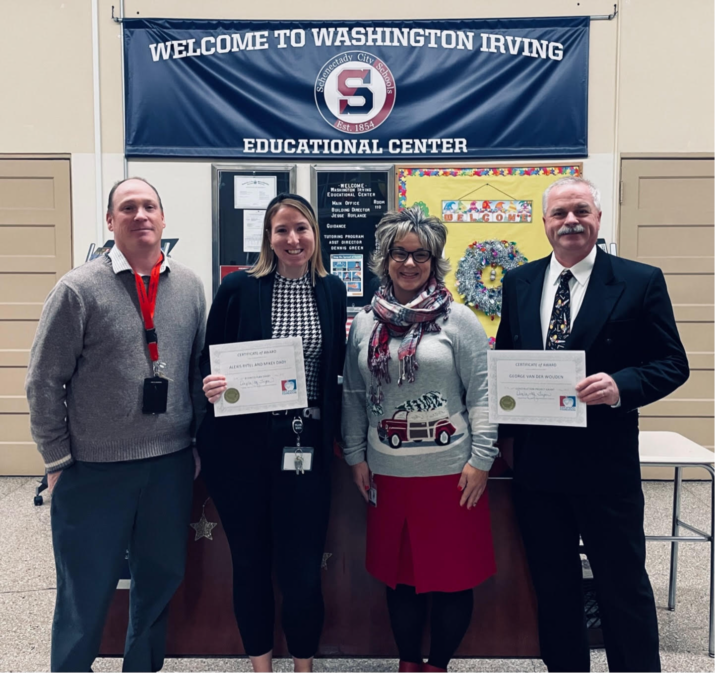 Photo:  Presentation of grant award to three teachers at WICE