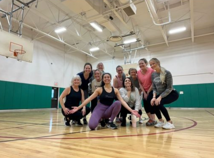 Photo:  Staff and faculty Zumba class at Woodlawn, led by ENL teacher Aly Nielsen 