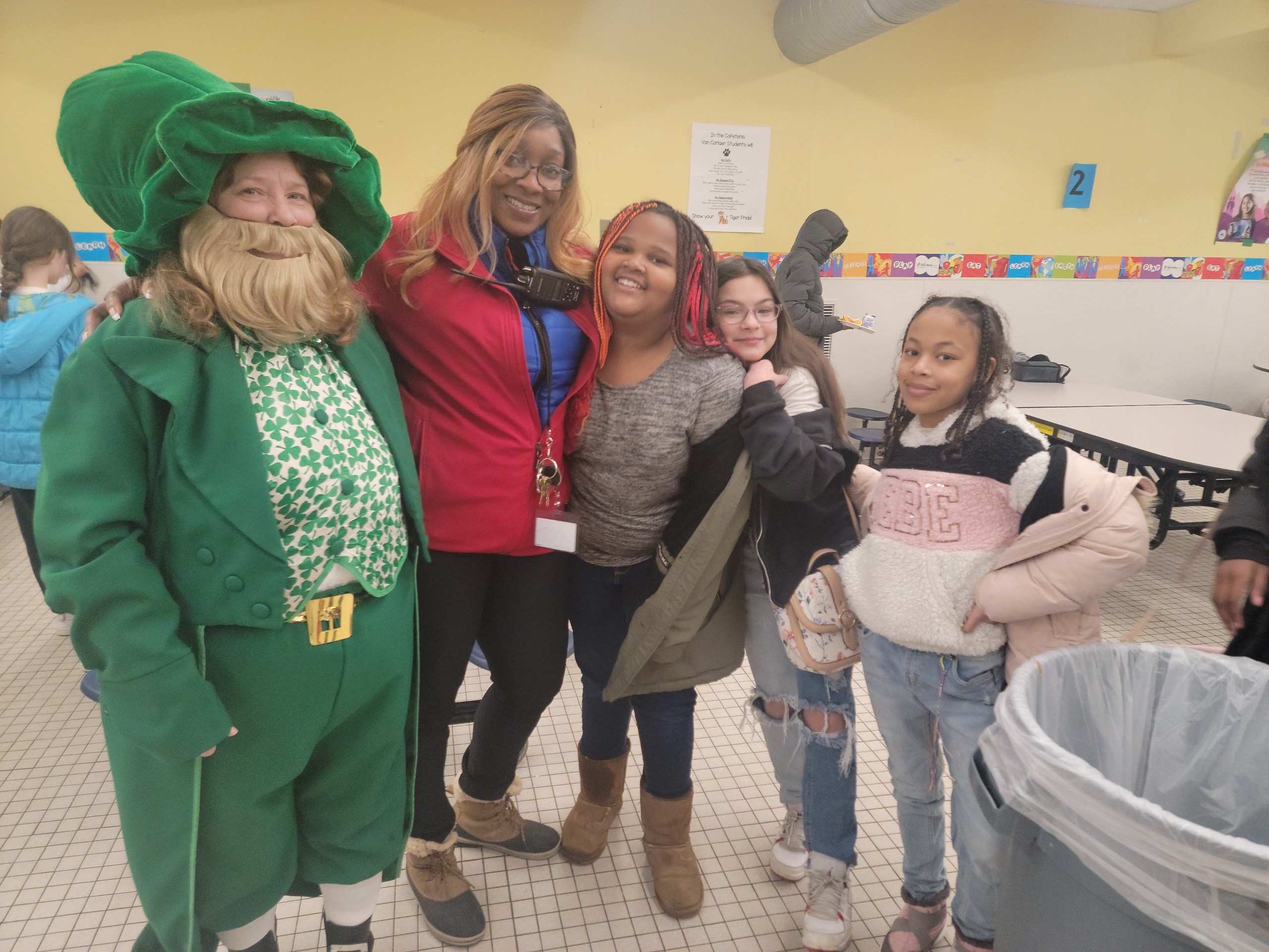 Van Corlaer Security Monitor Jamie Gentile and VC students getting to meet a leprechaun for St. Patrick's Day.