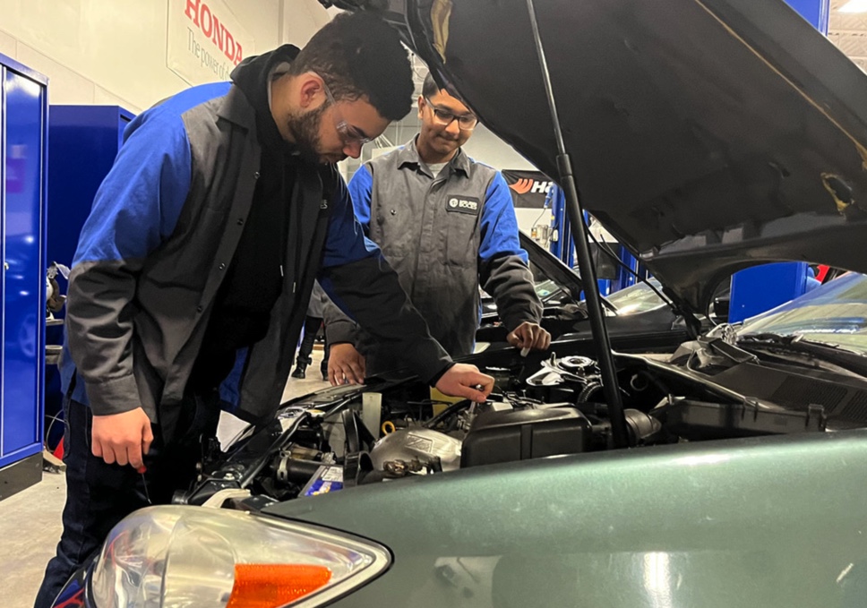 Photo:  Schenectady High School seniors Reuel Raju, Devon Blunt and Bhisham Rambjarps are among 96 students enrolled in the Capital Region BOCES Automotive Trades Technology program.
