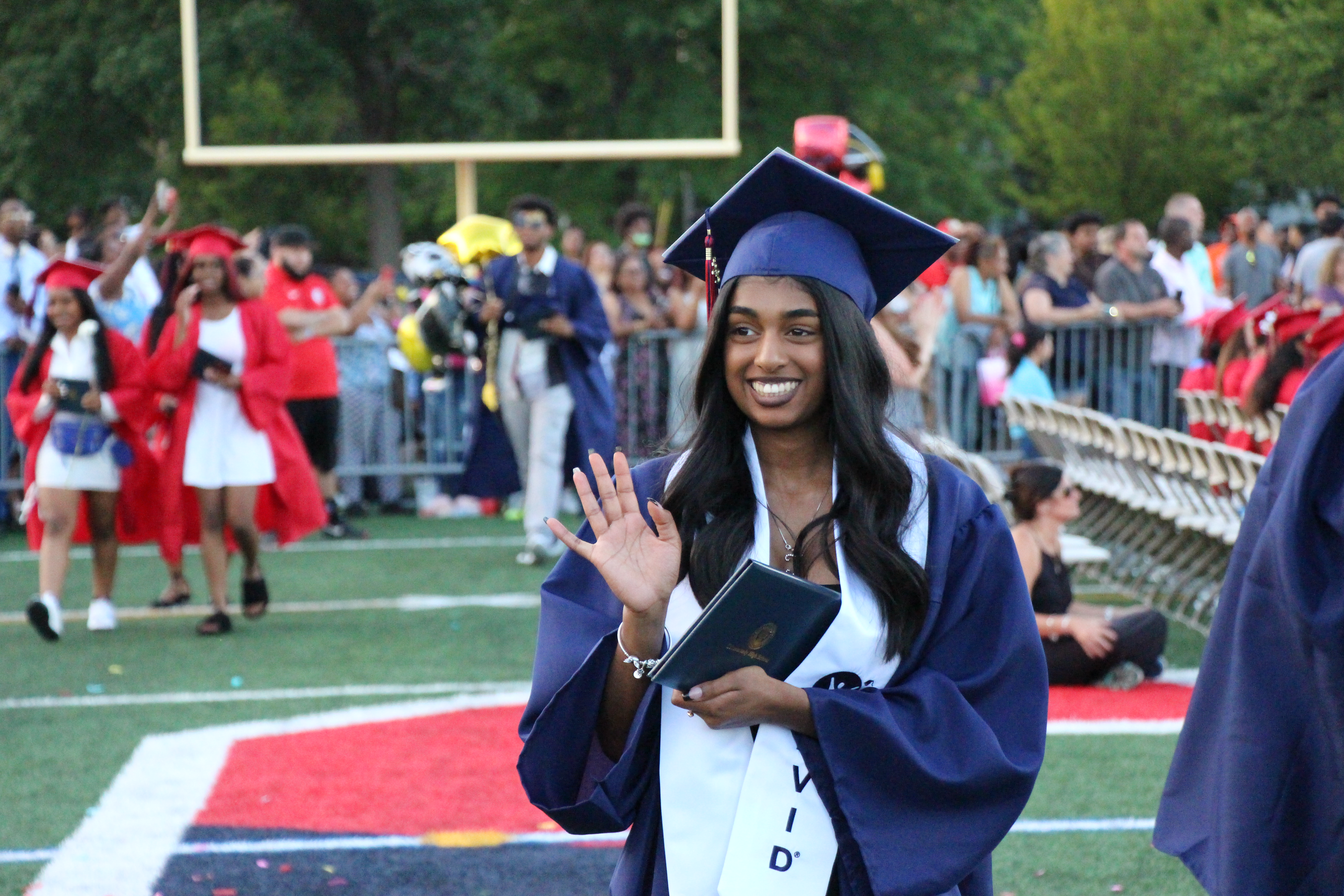 waving graduate