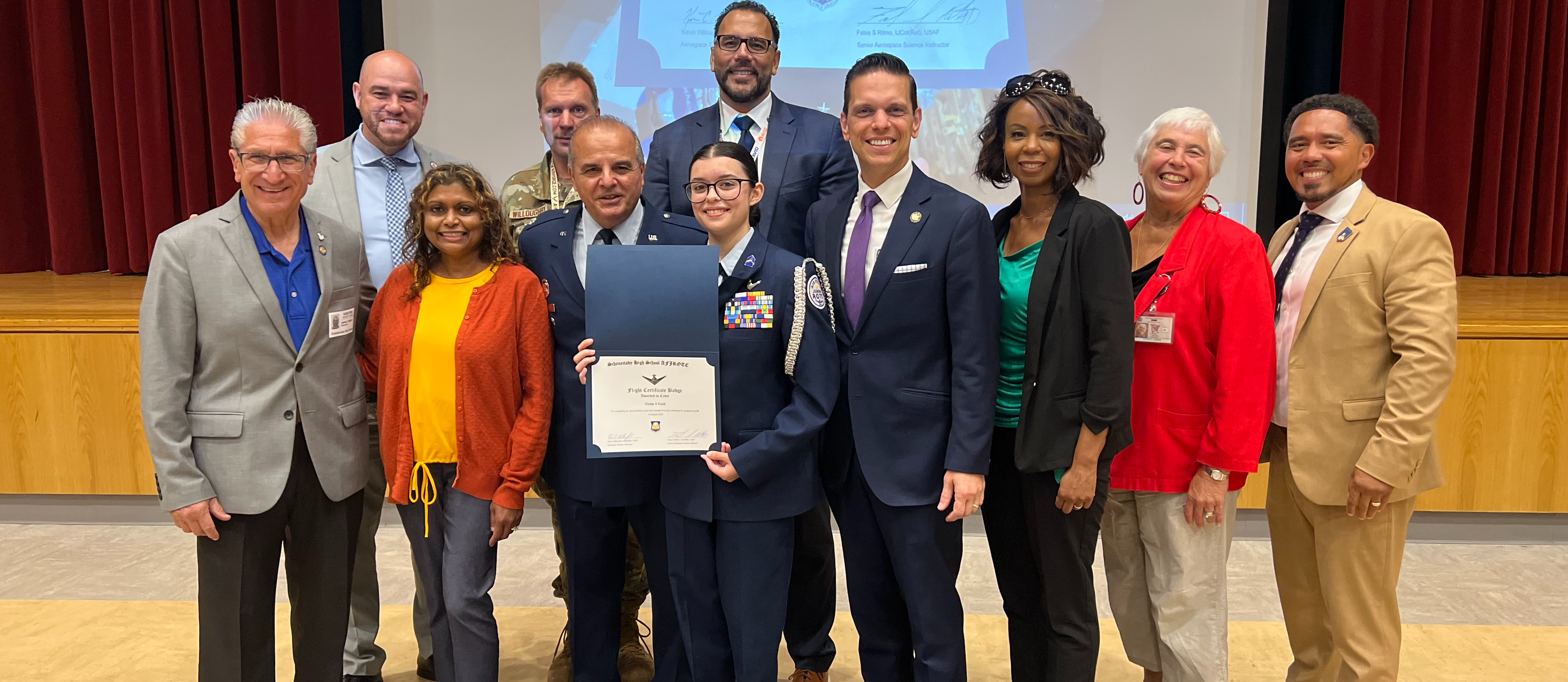 Alyssa Cook is awarded a certificate and her flying wings