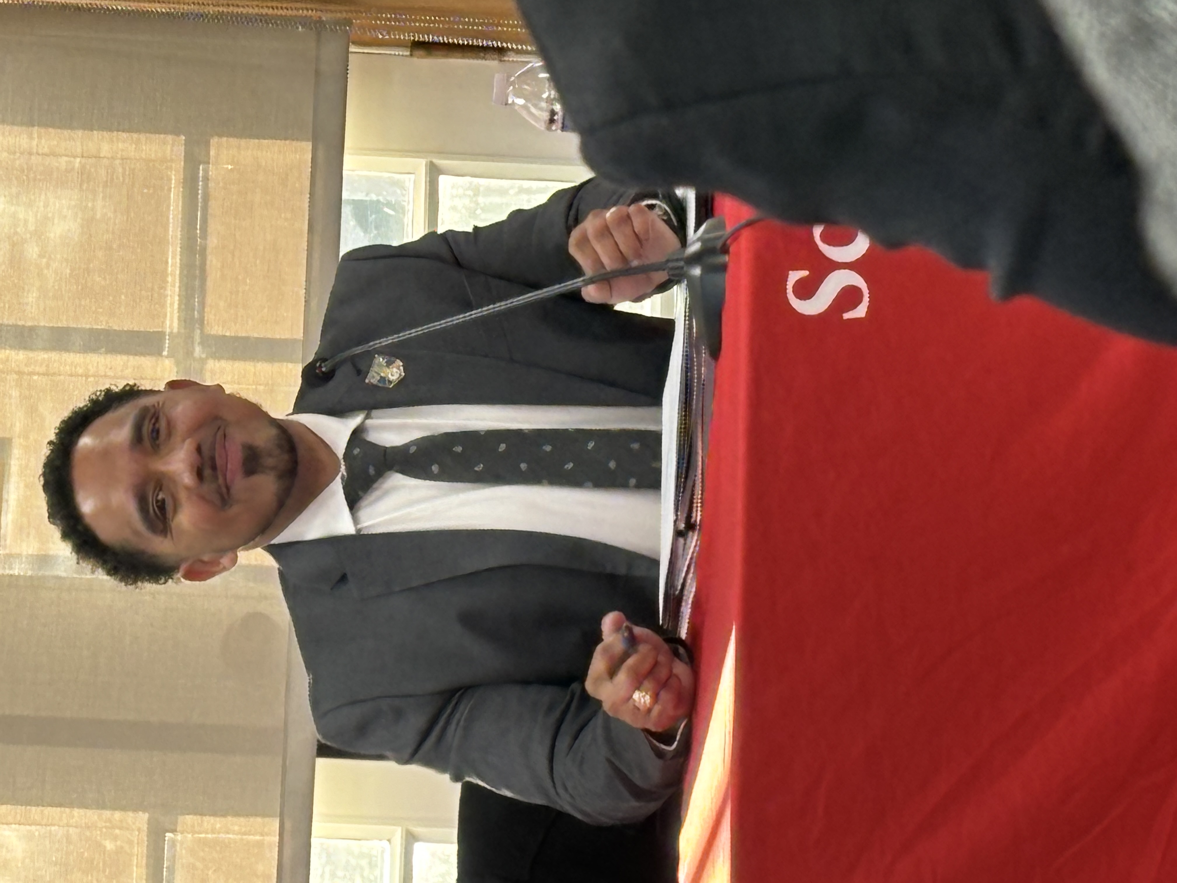Photo of Dr. Cotto at the board meeting on March 20