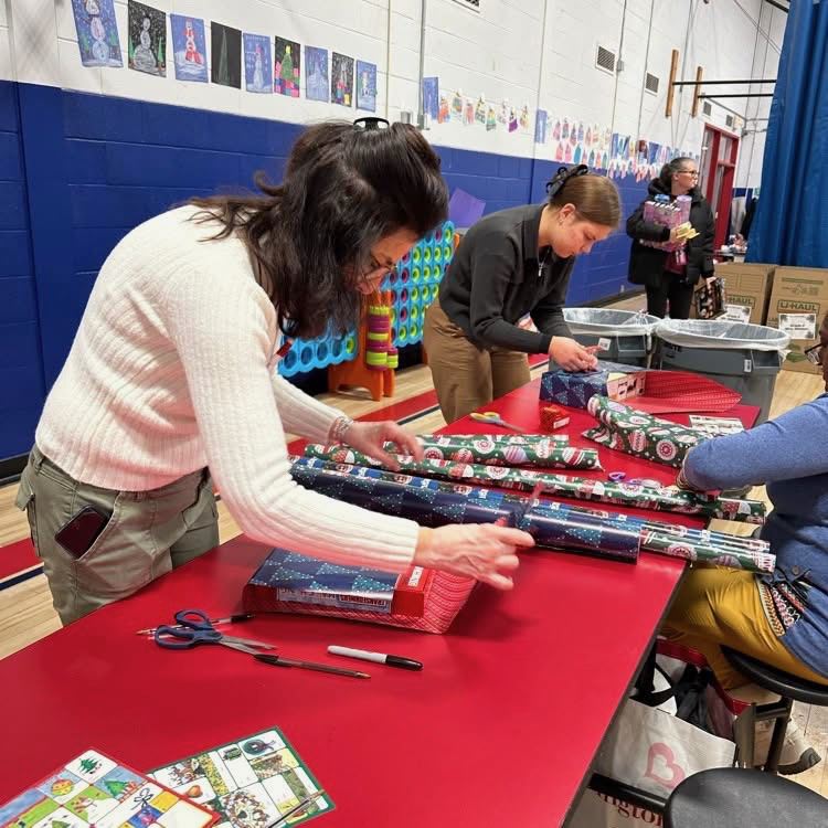 Staff wrapping presents