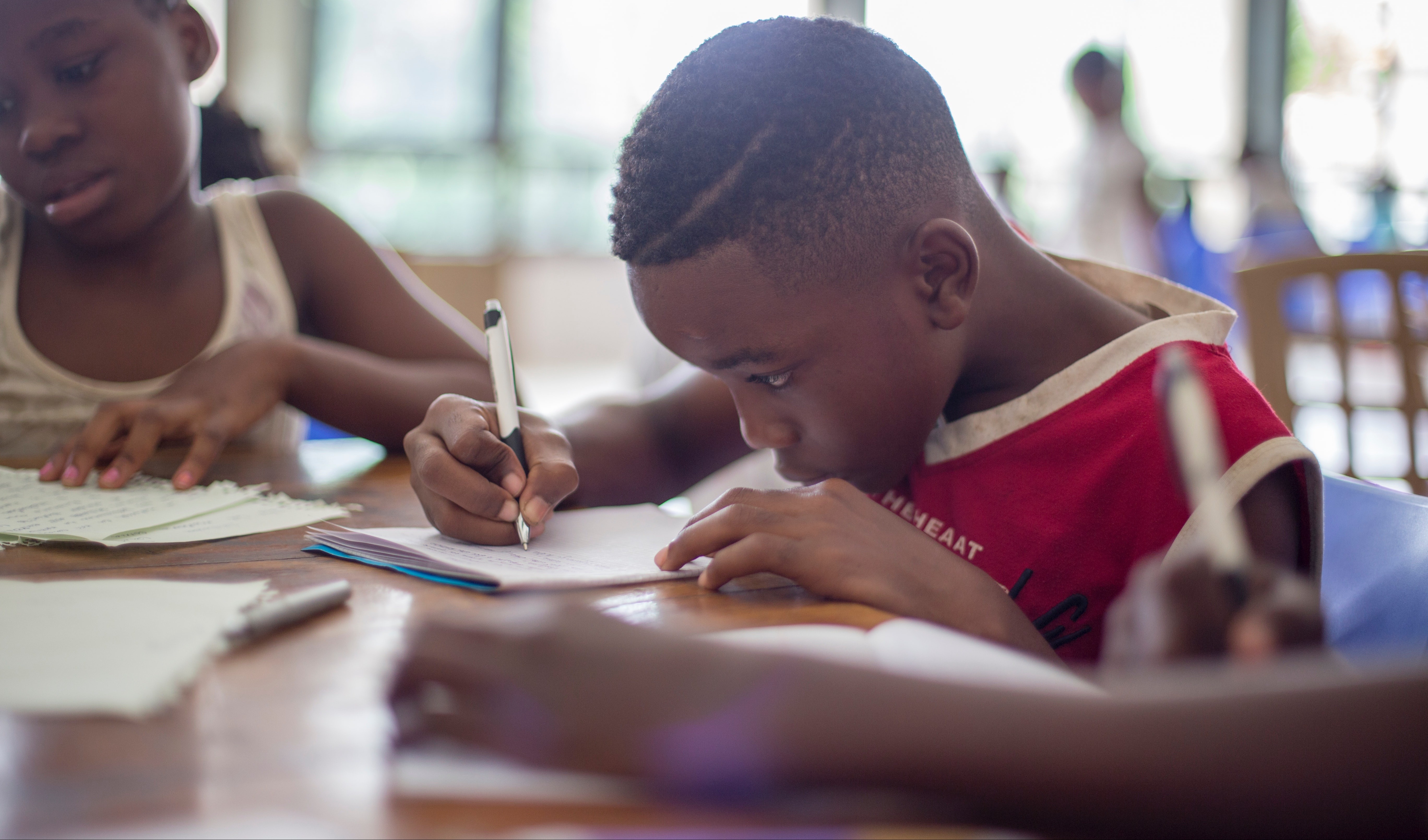 Kid Taking Notes