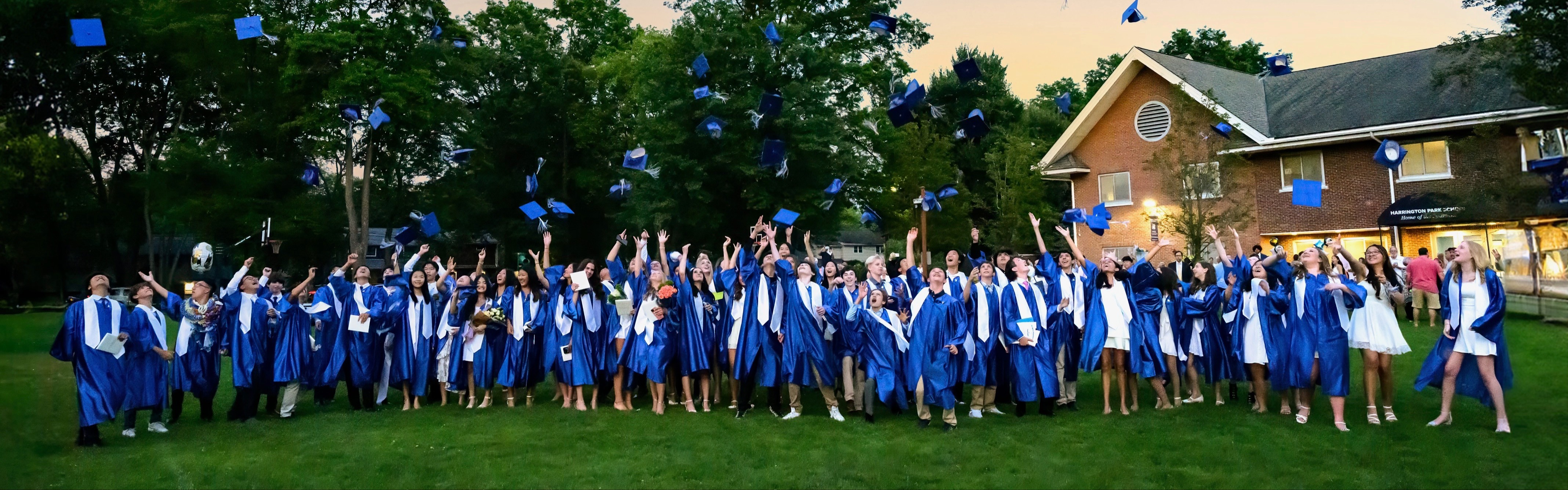 2024 Graduting Class in the Harrington Park School Back Field Throwing their caps in the air after graduating