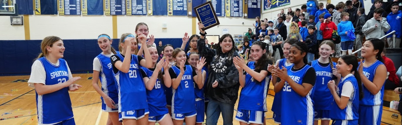 Harrington Park Girls Basketball Team  wins the Championship Game and pose with Coach Paternostro  and their plaque.