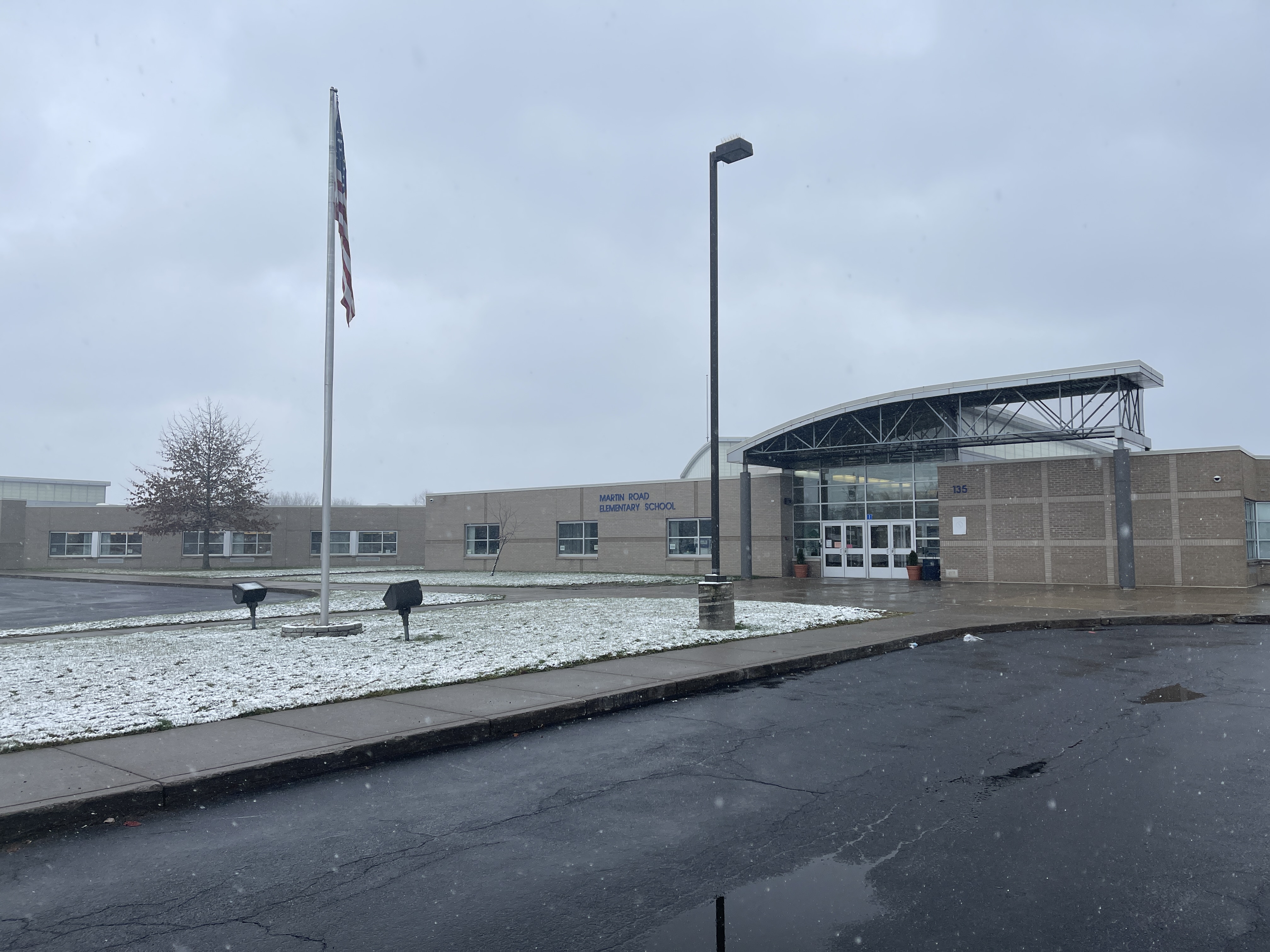 The front of Martin Road Elementary covered in snow