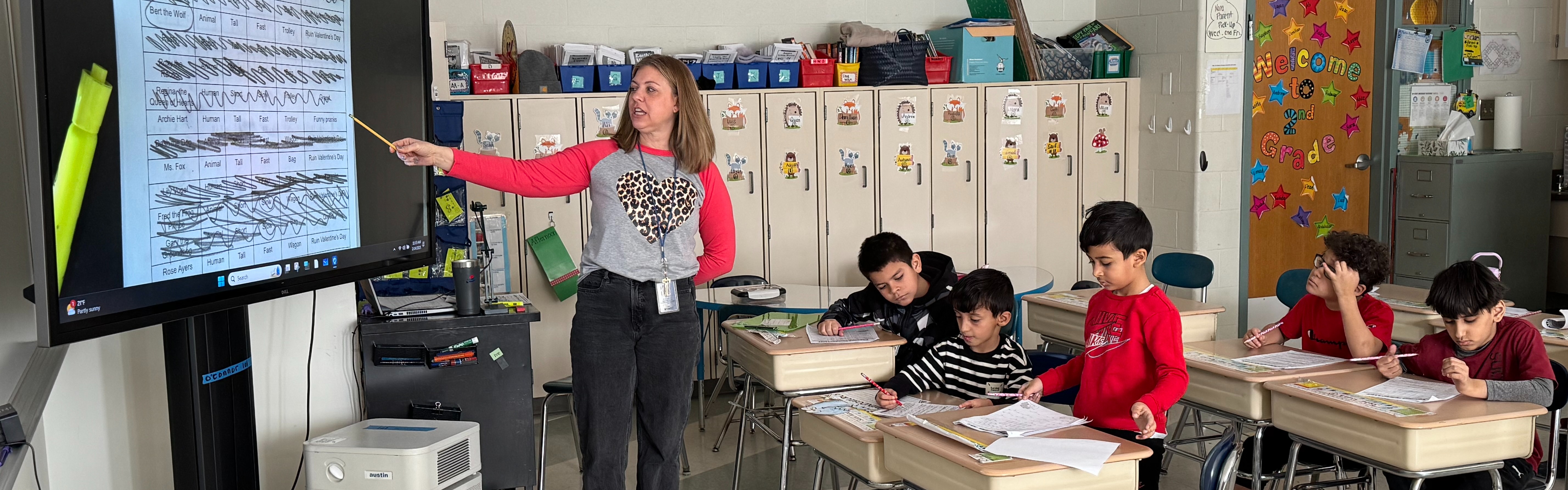 Teacher instructs students in class