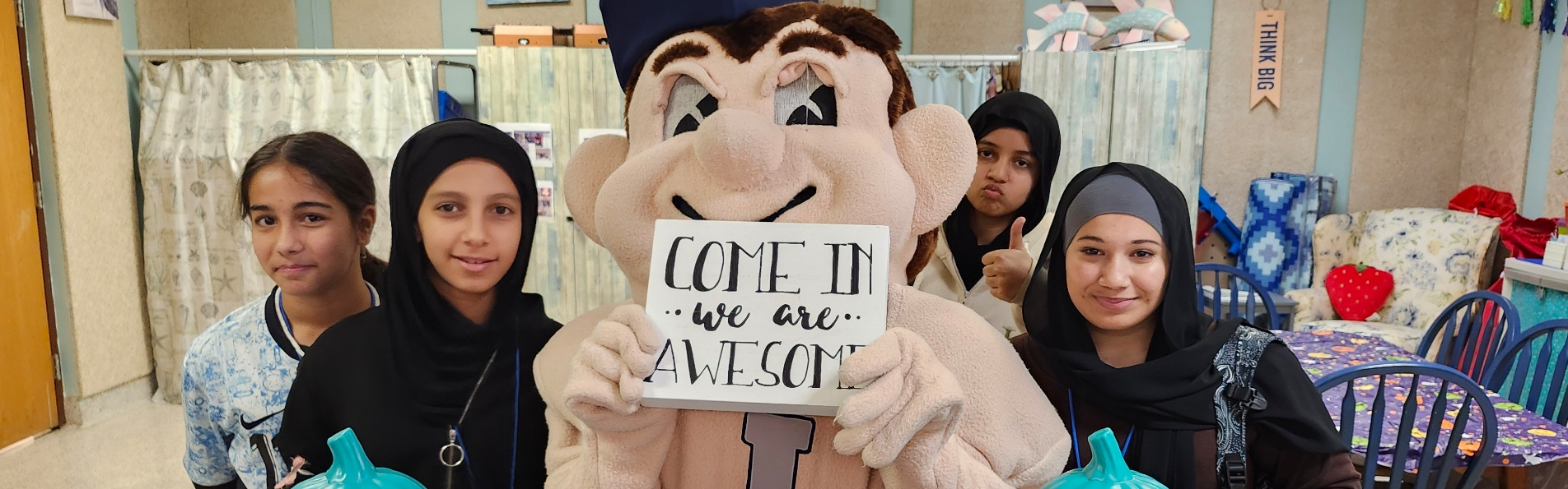 Lackawanna Steeler poses with students