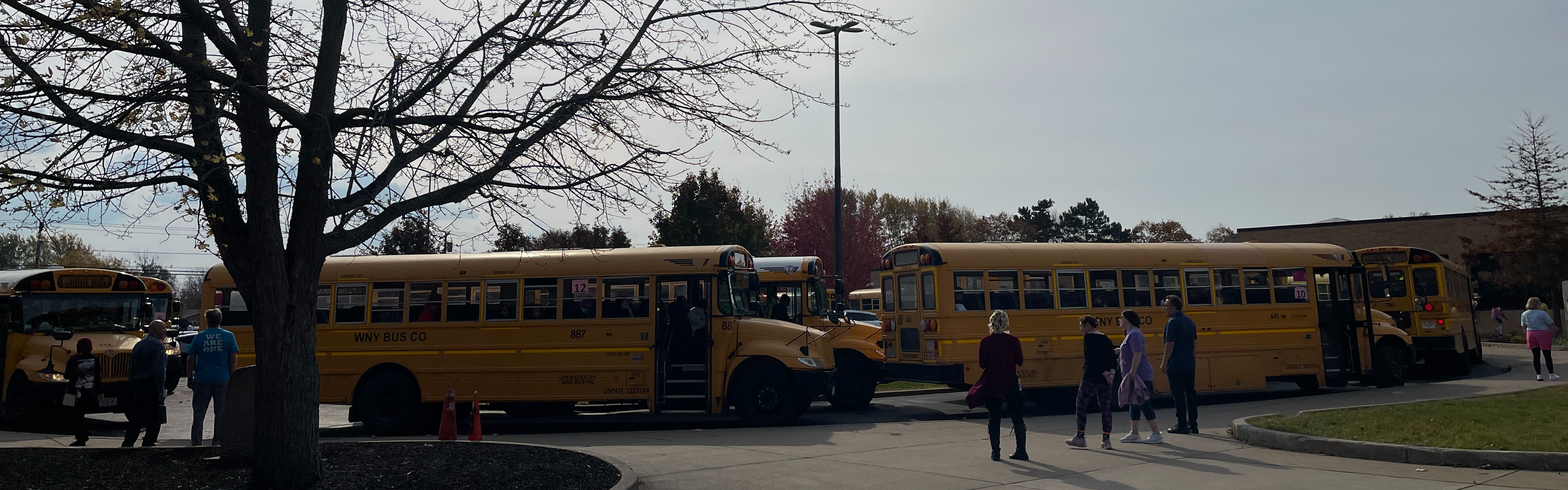 Buses gather outside for dismissal.