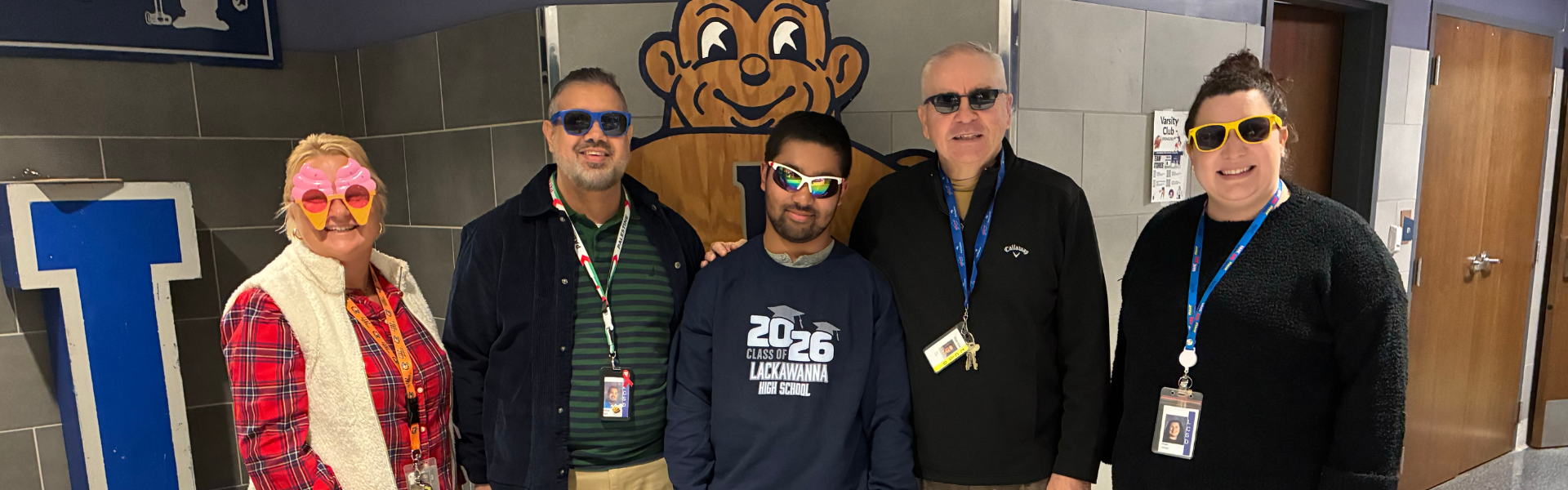 Lackawanna student and staff members pose for a photo with sunglasses on.