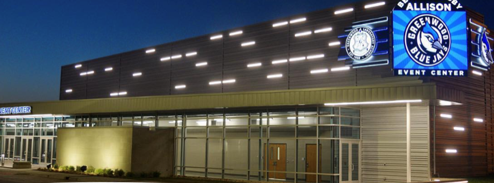 frtont facing view of the school entrance at night with external lights on 