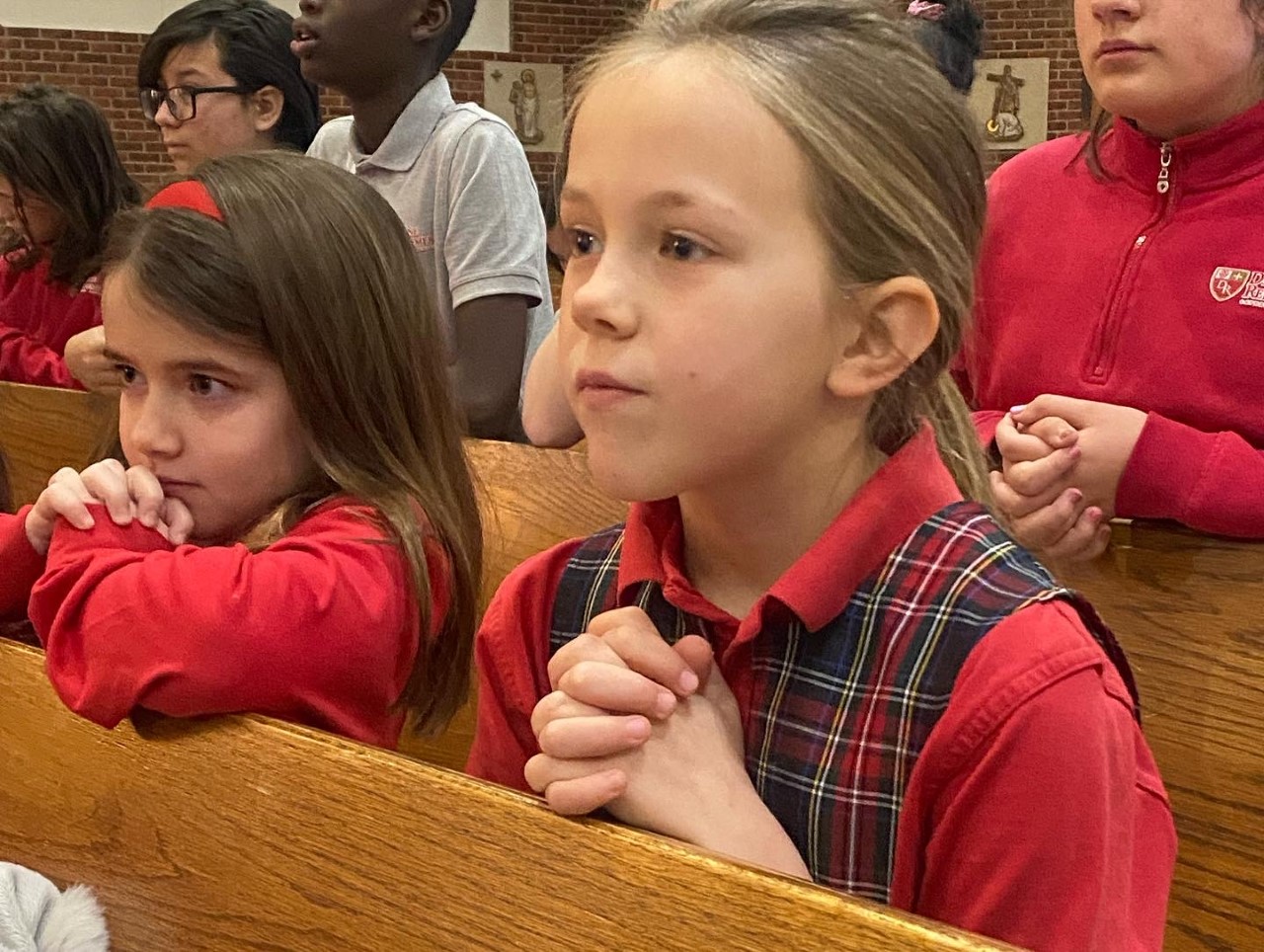 Students praying in church