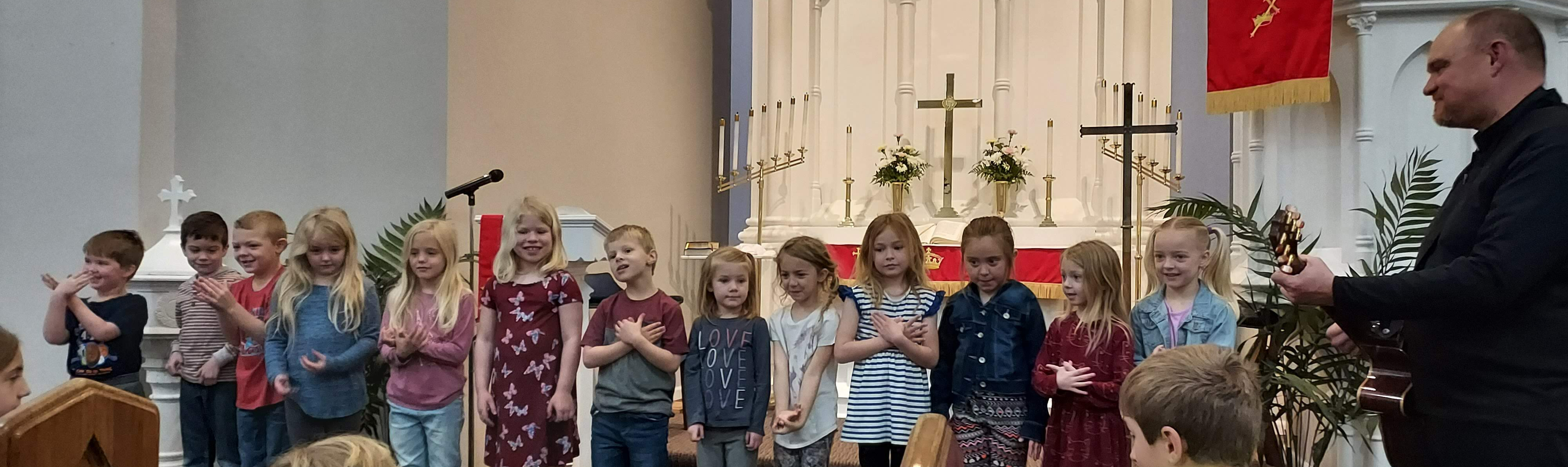 students singing in church
