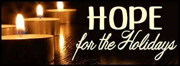 Hope for the holidays written next to lit candles