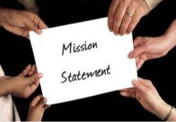 mission statement written on a white card with hands holding it
