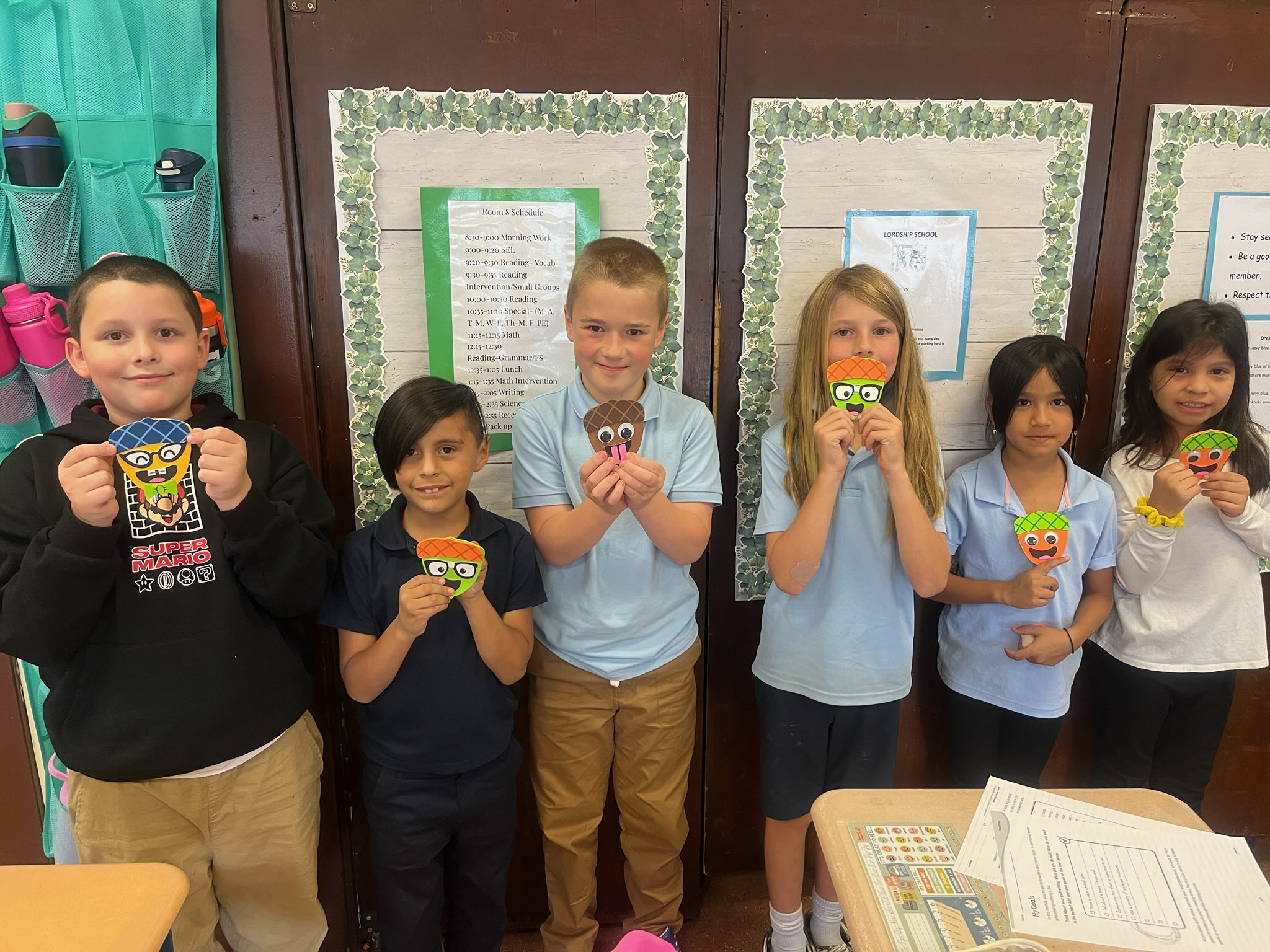 Students holding craft project