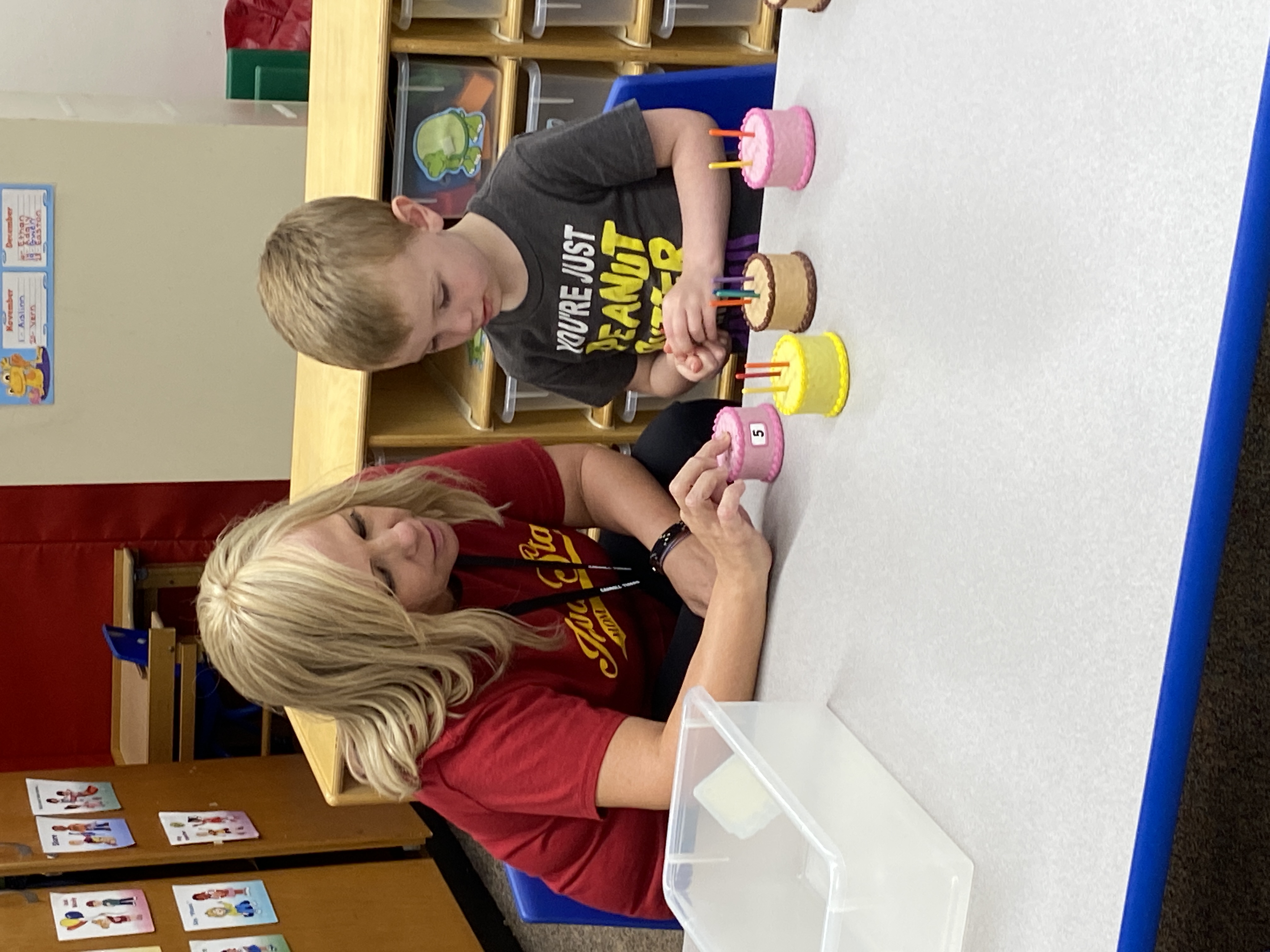teacher helping young student