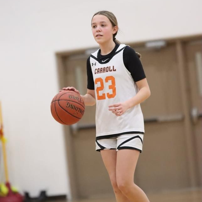 girl dribbling basketball