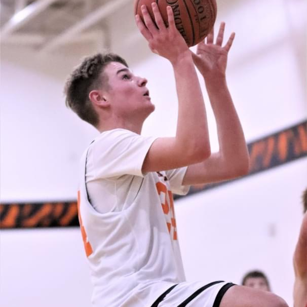 boy shooting layup