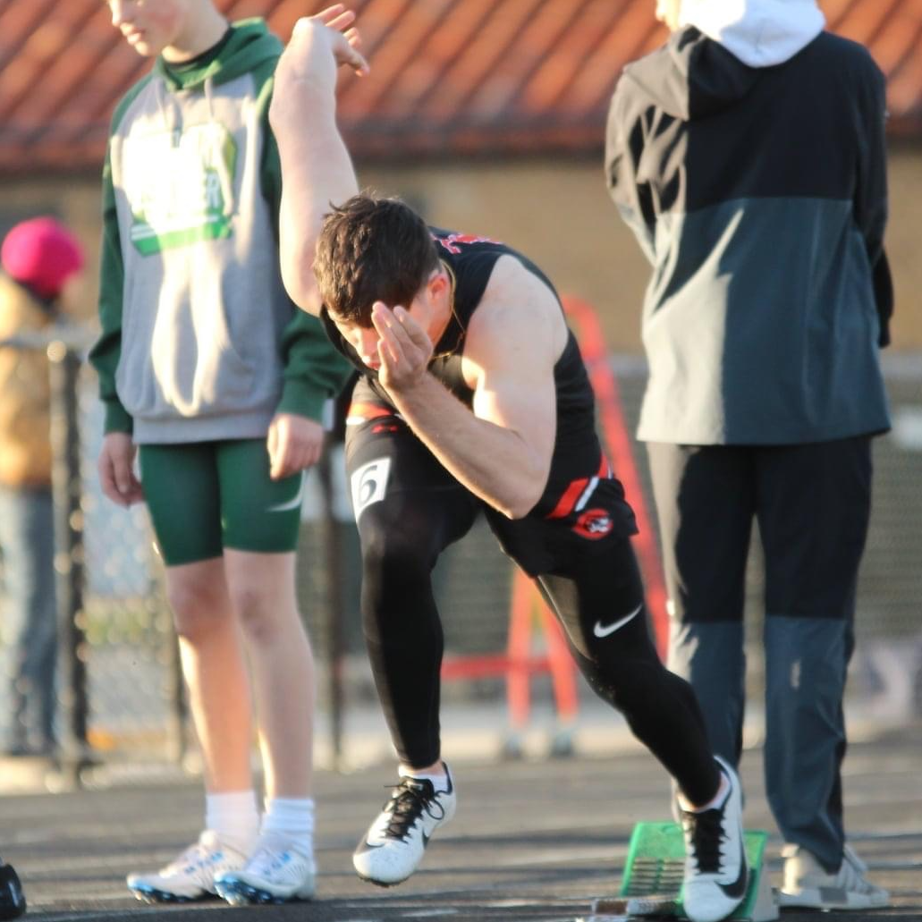 boy running track